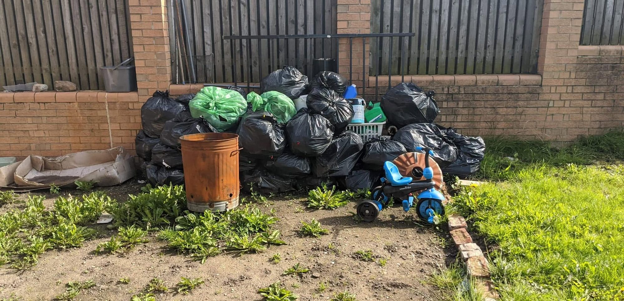 Bagged rubbish and household items ready for waste removal