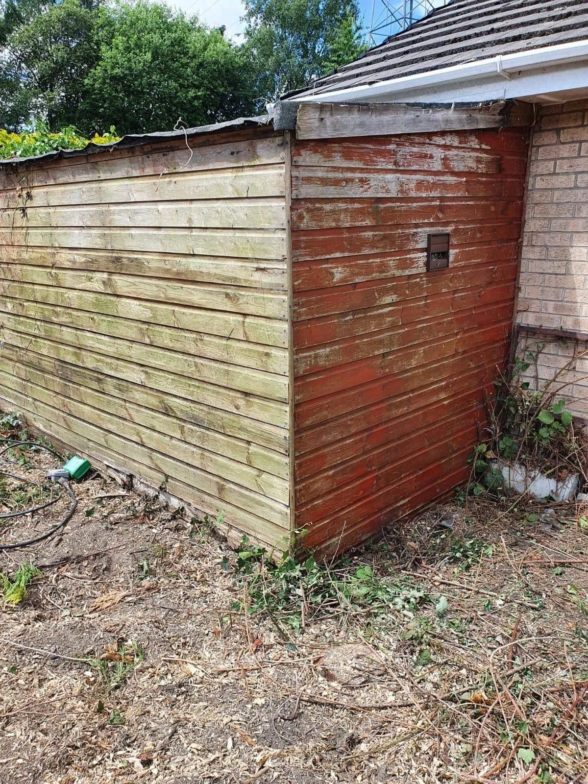 Brick and timber garden outbuilding awaiting clearance