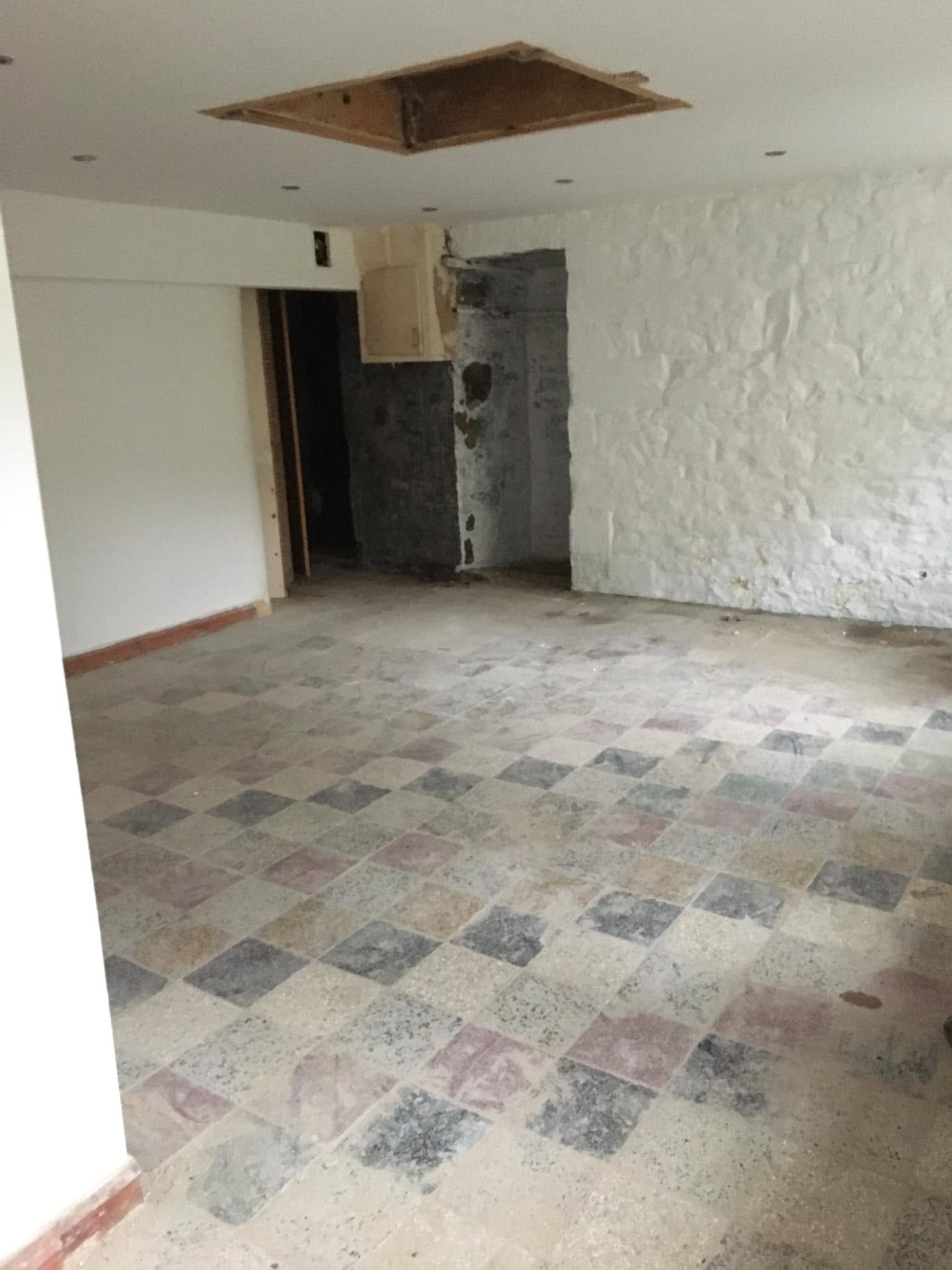 Empty room with tiled floor after belongings have been removed
