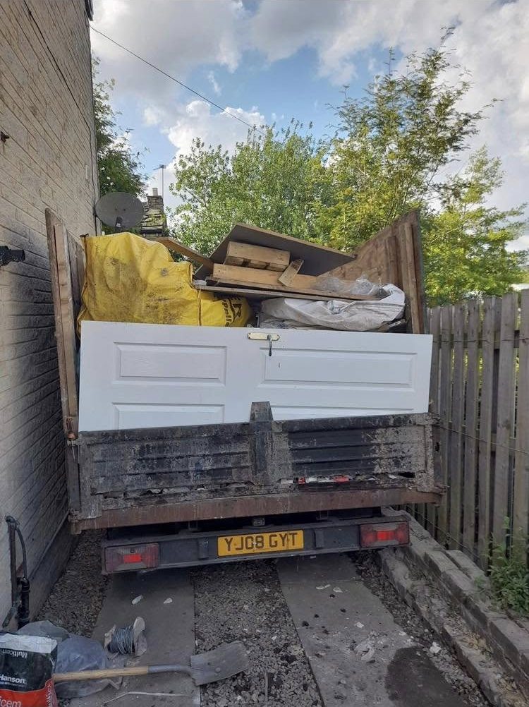 Truck loaded with timber and renovation materials
