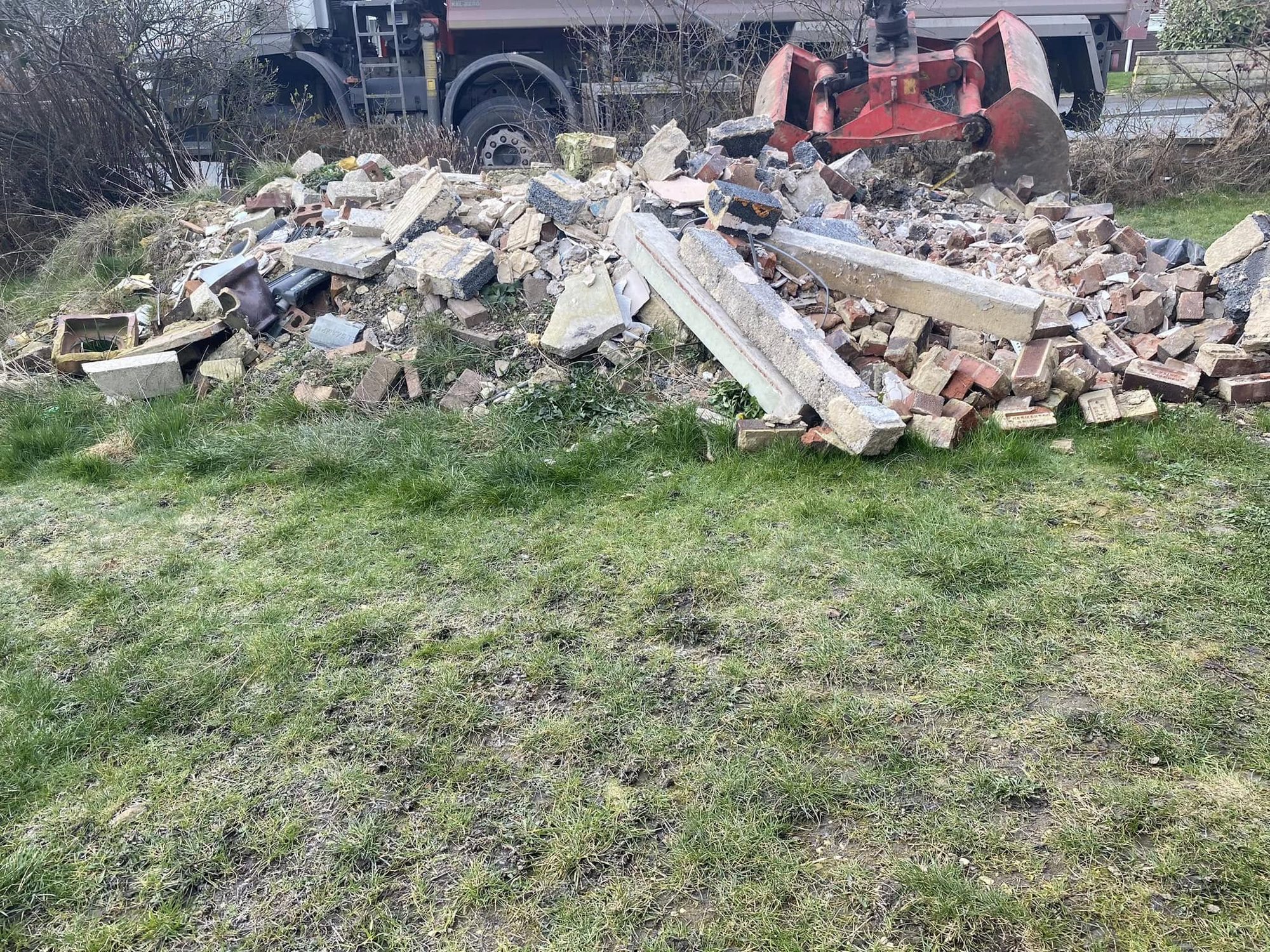 Pile of bricks and renovation rubble awaiting trade waste removal